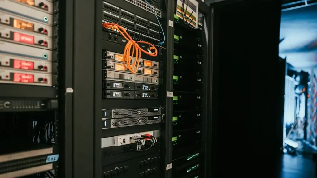 Server racks and network equipment in a server room.
